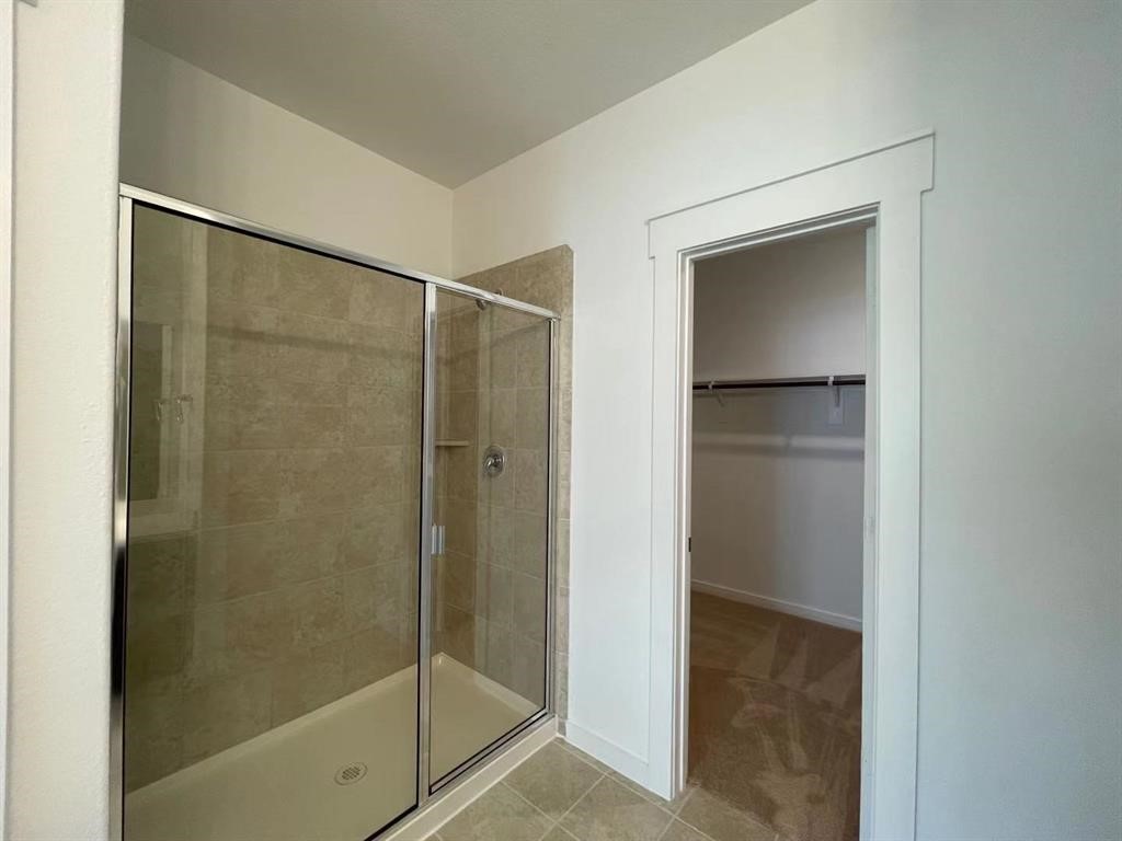 815 Summer Village Way Rosenberg, TX 77469 - Photo 12 of 21 a bathroom with a glass shower door
