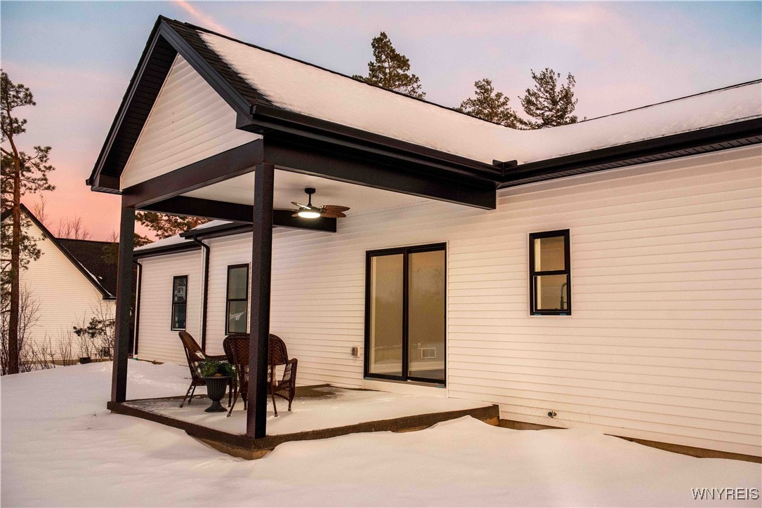 6220 Versailles Road Hamburg, NY 14085 - Photo 5 of 36 COVERED REAR PATIO OVERLOOKS YARD BORDERED BY TREE