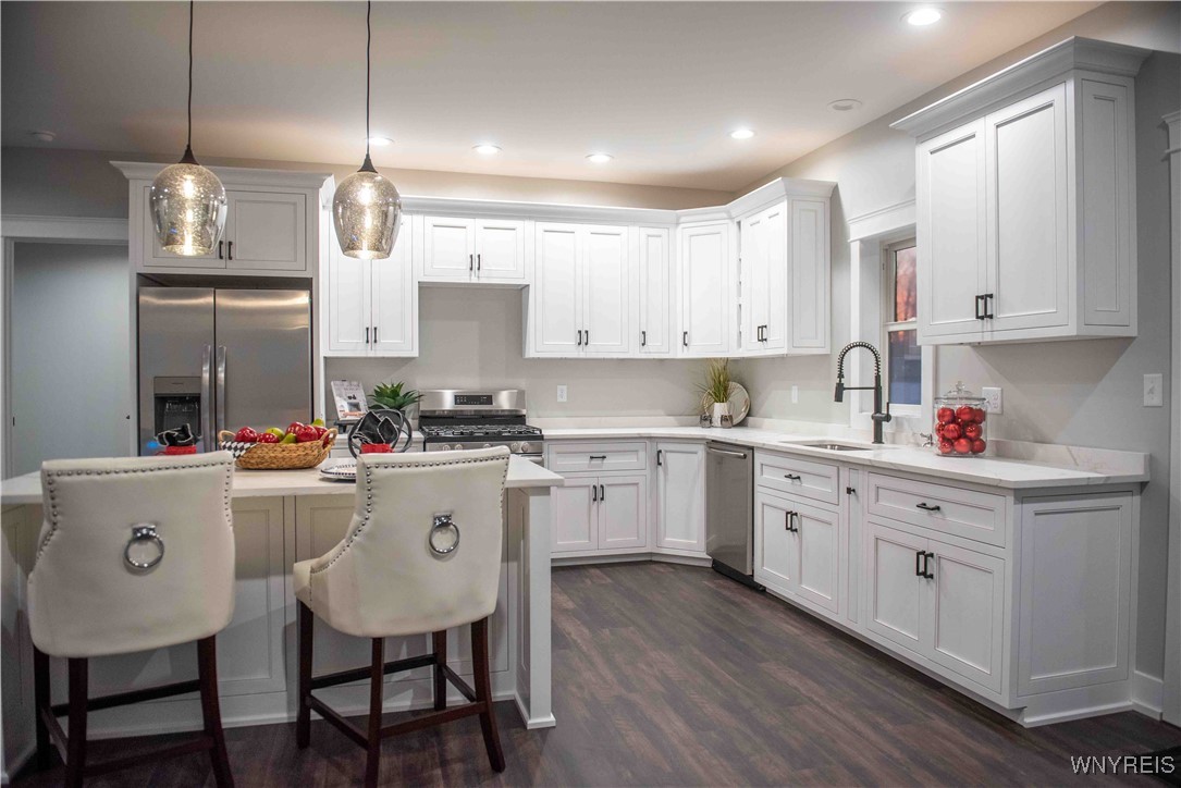 6220 Versailles Road Hamburg, NY 14085 - Photo 6 of 36 STUNNING CUSTOM MADE 42"CABINETRY WITH QUARTZ COU