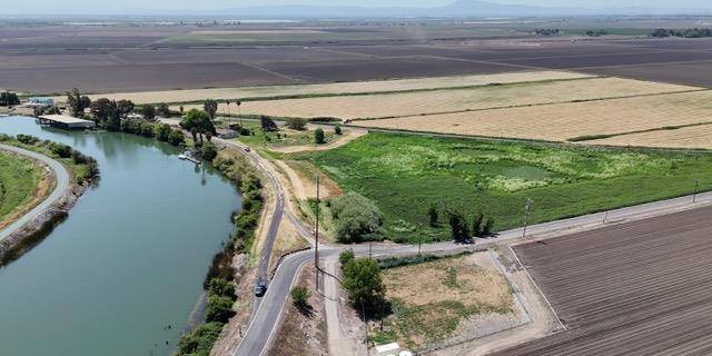 0 Terminous Road Isleton, CA 95641 - Photo 9 of 11 a view of a lake with a mountain