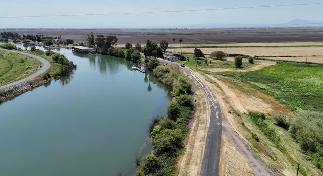 0 Terminous Road Isleton, CA 95641 - Photo 10 of 11 a view of a lake with a yard and outdoor seating
