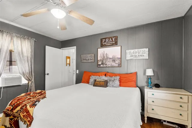 a bathroom with a granite countertop sink a mirror a vanity and a shower