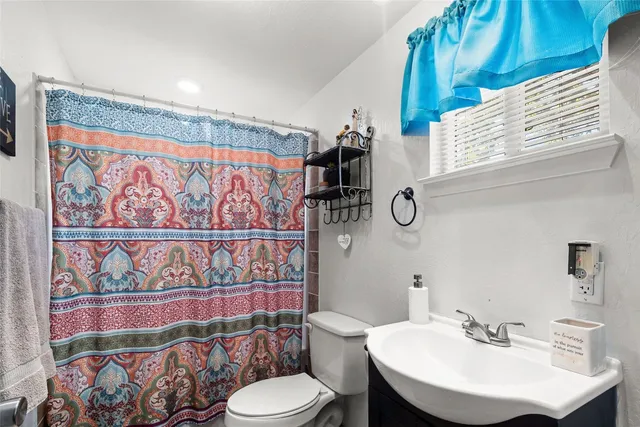 a view of a patio with table and chairs