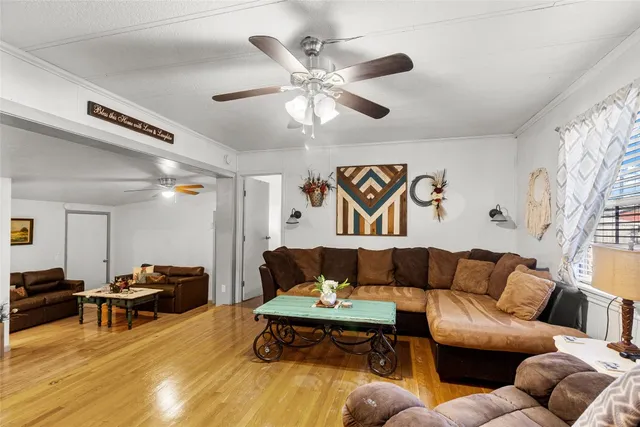 a kitchen with stainless steel appliances a refrigerator and a dining table