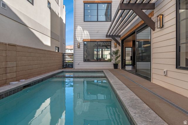 5367 Cyan Lane St. George, UT 84790 - Photo 46 of 49 Private courtyard pool with integrated spa and dark tile coping