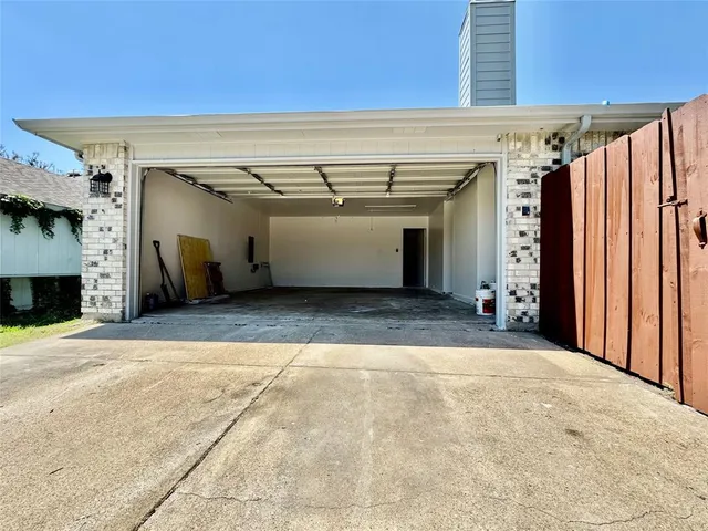 a view of a terrace with a chair and floor to ceiling window