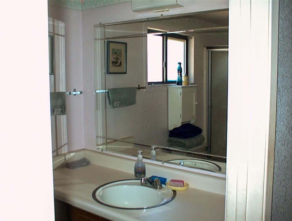 50245 Greenhill Road Squaw Valley, CA 93675 - Photo 24 of 25 a bathroom with a granite countertop sink and a mirror