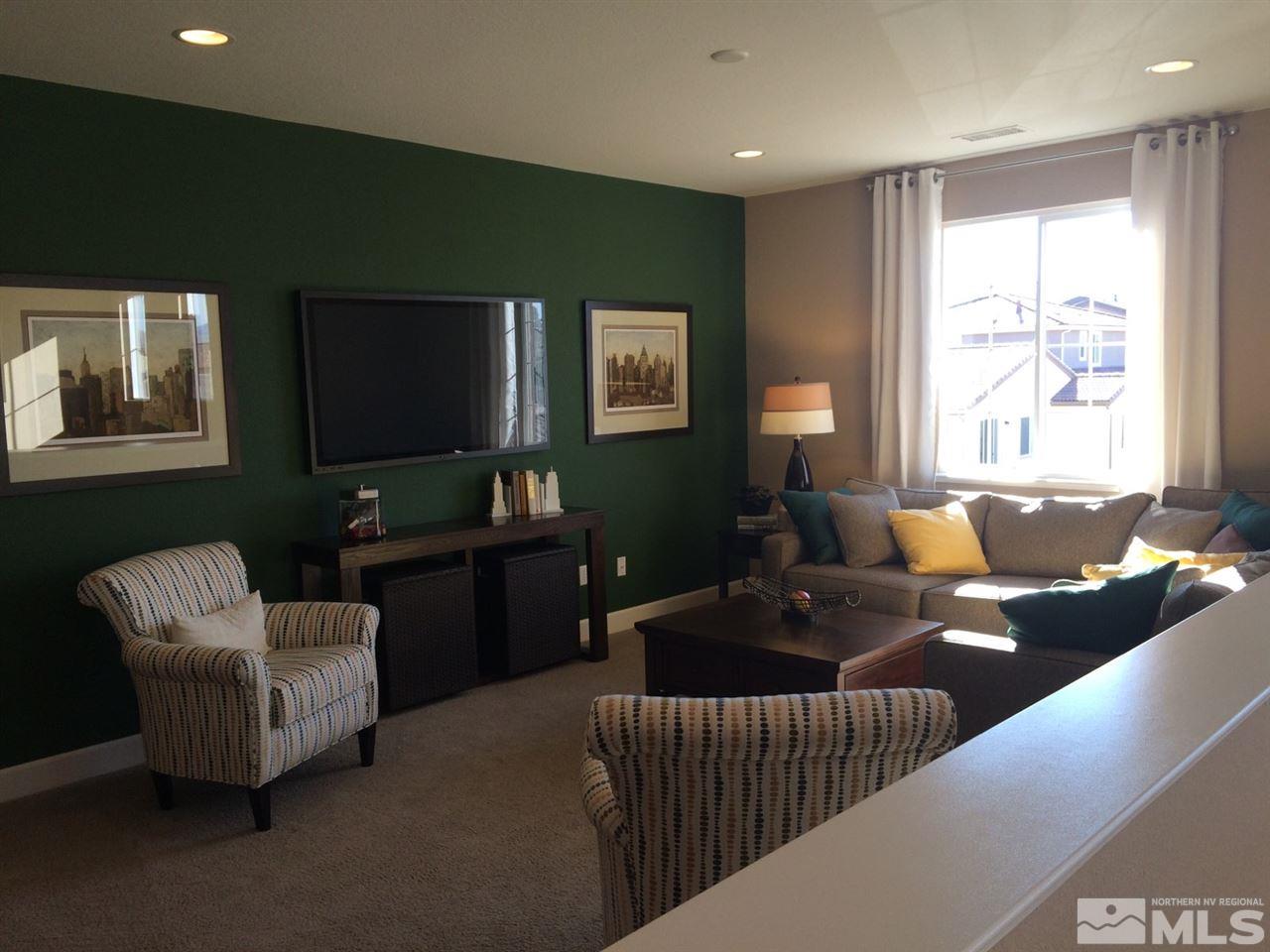 1840 Wind Walker Drive Reno, NV 89521 - Photo 5 of 11 a living room with furniture and a flat screen tv