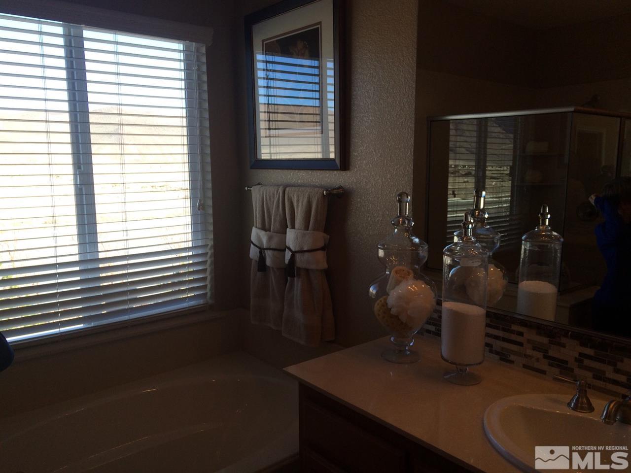 1840 Wind Walker Drive Reno, NV 89521 - Photo 6 of 11 a dining room with table lamp and window