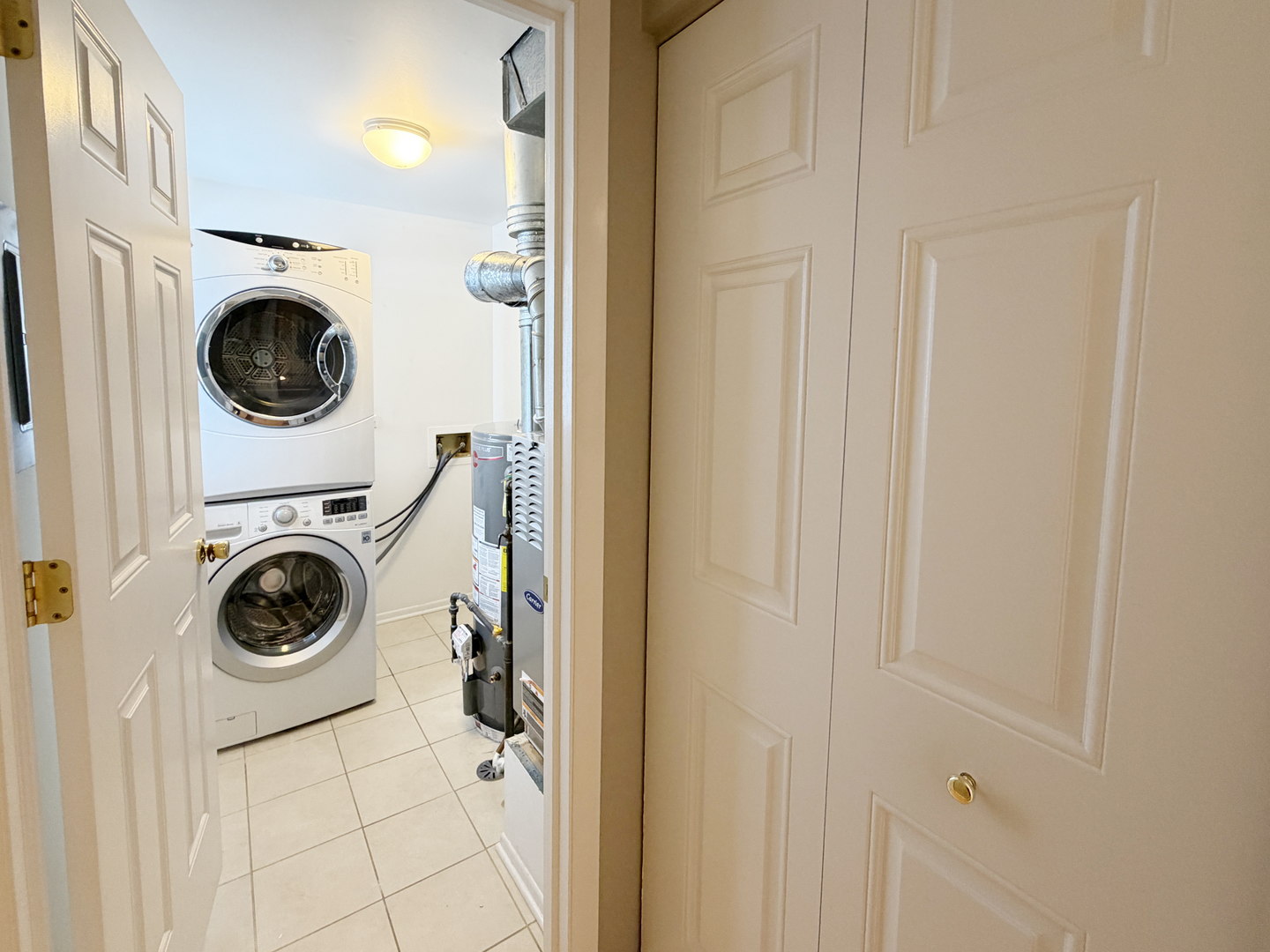 22 Creekside Circle, Unit D Elgin, IL 60123 - Photo 18 of 23 a utility room with sink dryer and washer