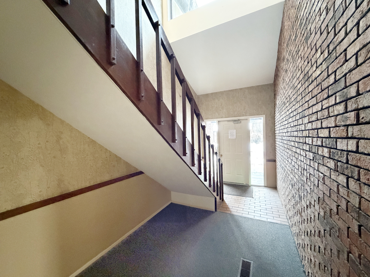 22 Creekside Circle, Unit D Elgin, IL 60123 - Photo 20 of 23 a view of staircase with wooden floor and wall