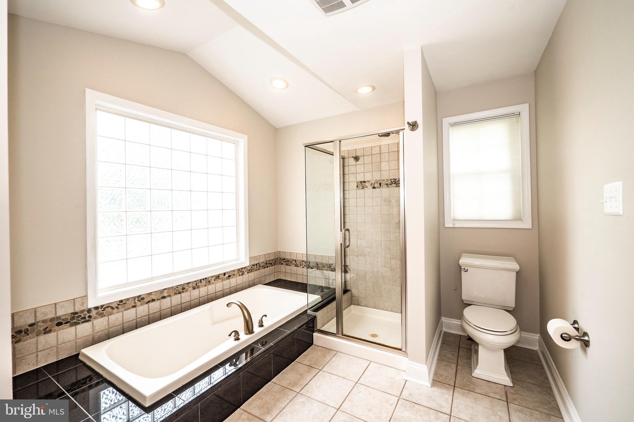 8933 Watkins Road Gaithersburg, MD 20882 - Photo 27 of 65 Main Level -Primary Bathroom Suite w/ Soaking Tub