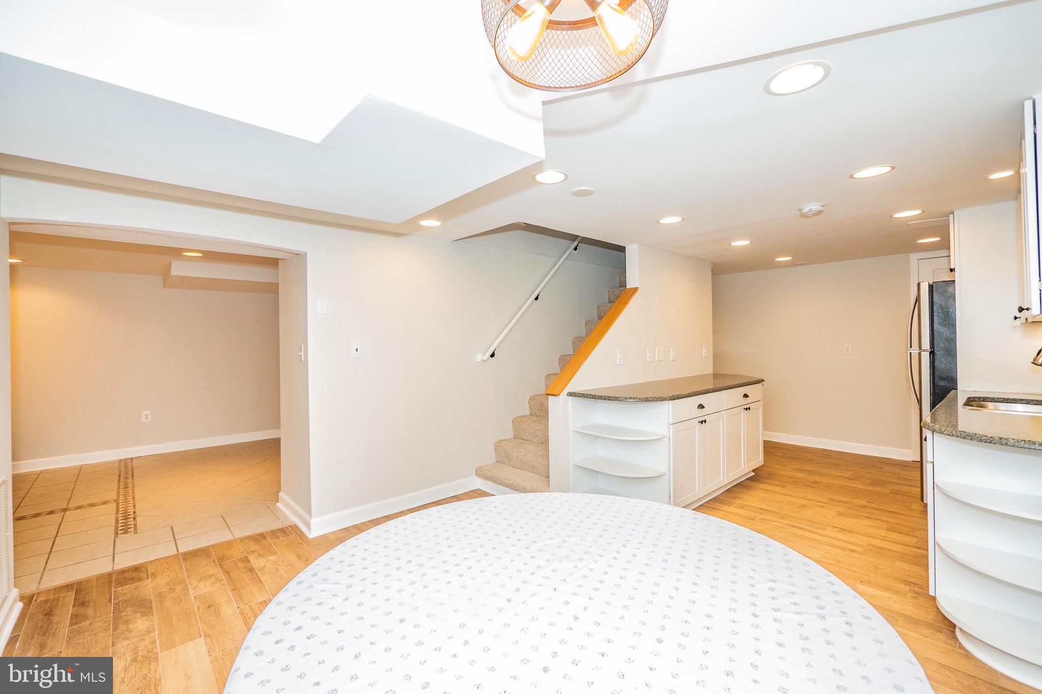 8933 Watkins Road Gaithersburg, MD 20882 - Photo 44 of 65 Lower Level - Kitchenette and Dining Area