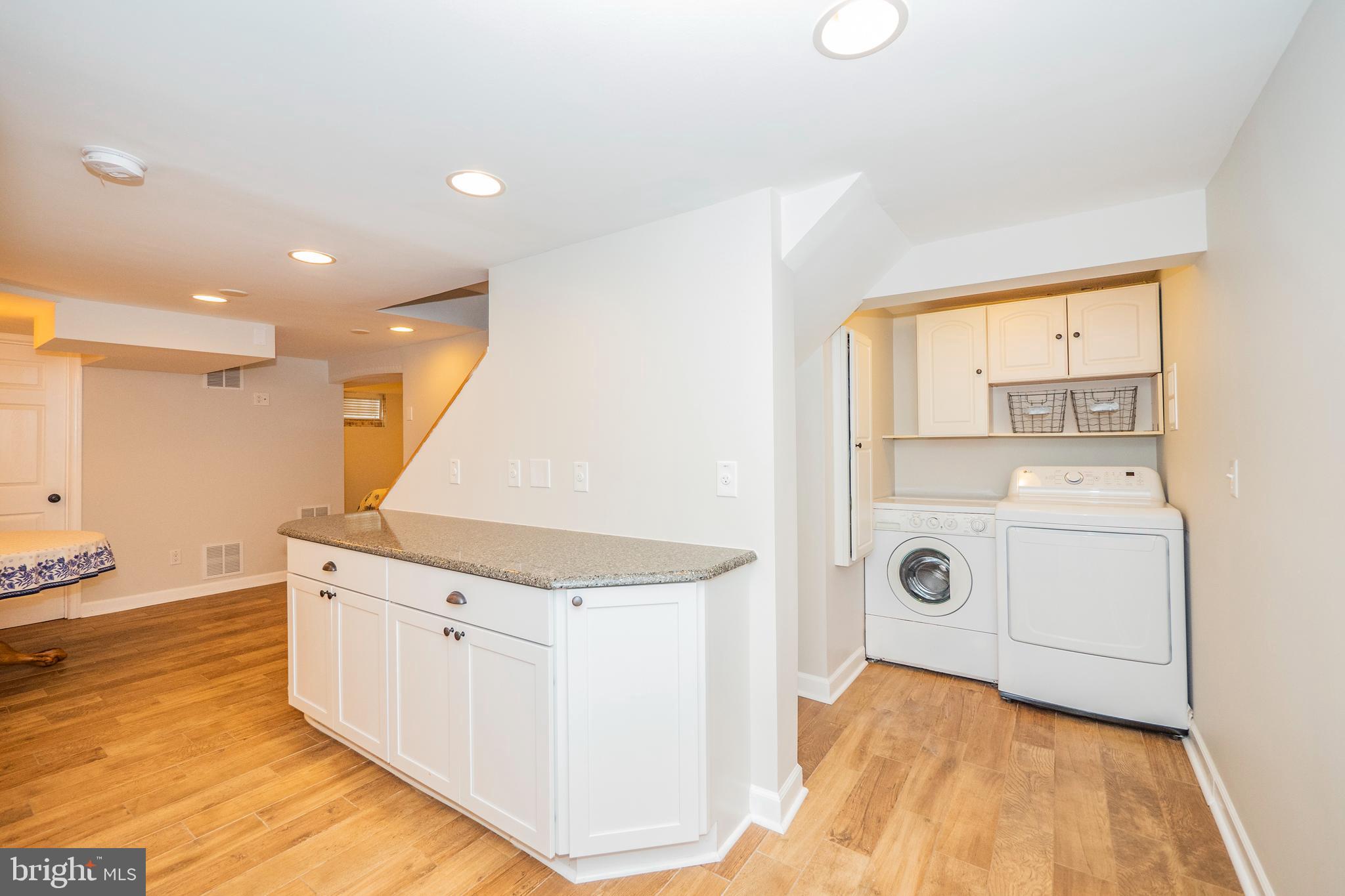 8933 Watkins Road Gaithersburg, MD 20882 - Photo 47 of 65 Lower Level - Kitchenette & Laundry Area