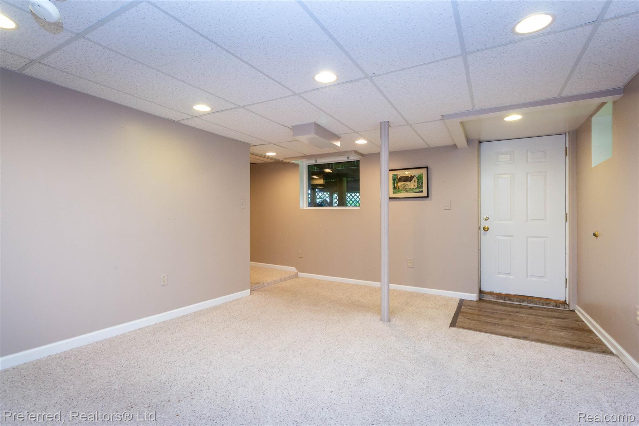 9840 Currie Road Northville, MI 48167 - Photo 40 of 62 Finished below grade area with a paneled ceiling, recessed lighting, and light carpet