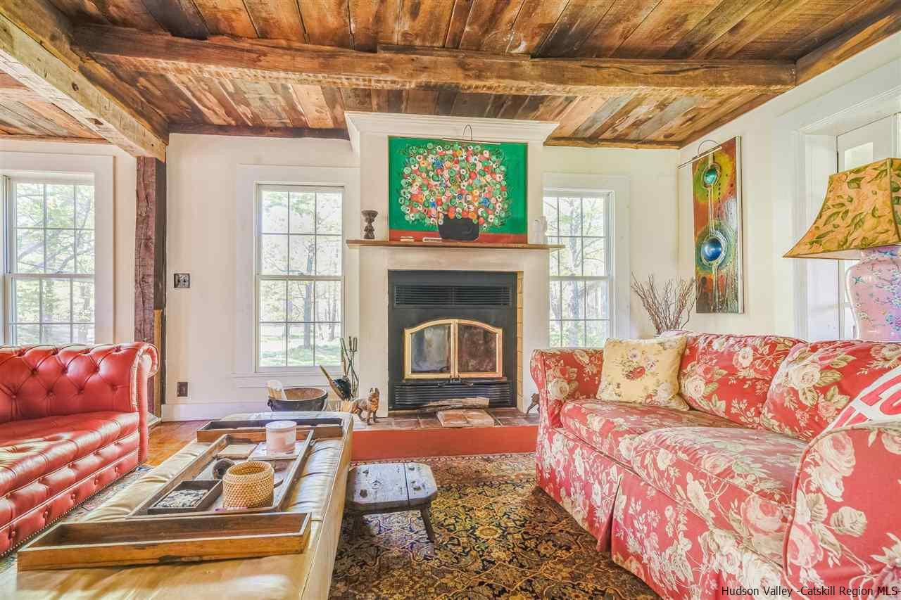 1245 High Falls Road Catskill, NY 12414 - Photo 17 of 34 a living room with furniture a flat screen tv and a fireplace