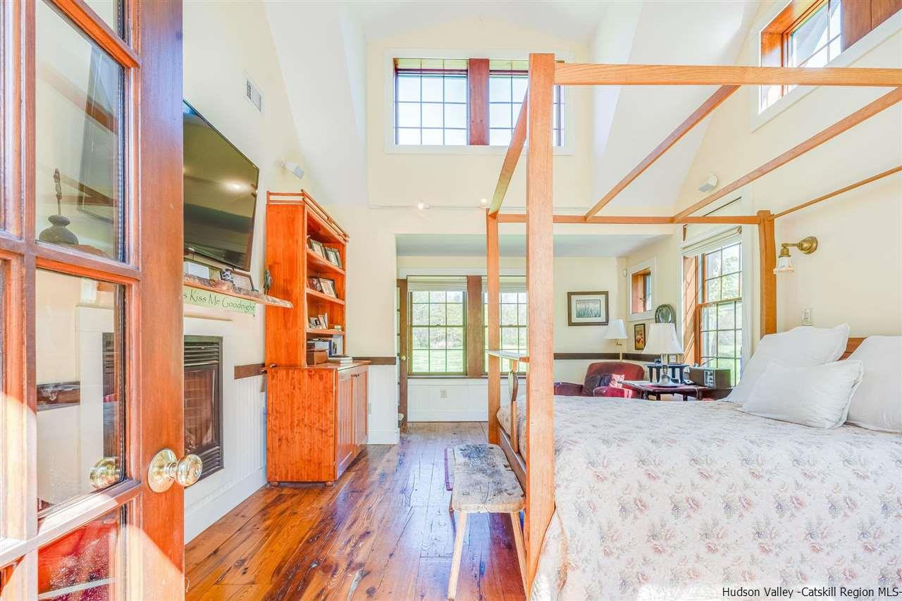 1245 High Falls Road Catskill, NY 12414 - Photo 20 of 34 a bedroom with a bed and a large window