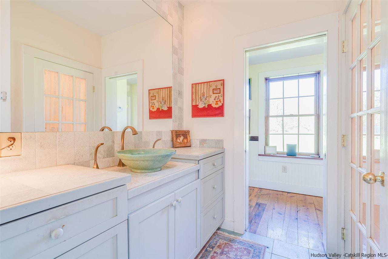 1245 High Falls Road Catskill, NY 12414 - Photo 23 of 34 a bathroom with a sink a vanity and a window