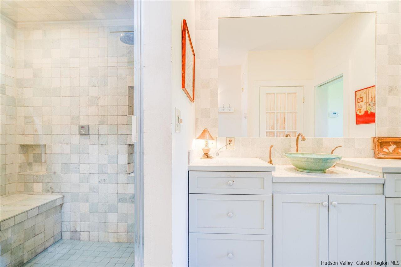 1245 High Falls Road Catskill, NY 12414 - Photo 24 of 34 a bathroom with a sink and a mirror