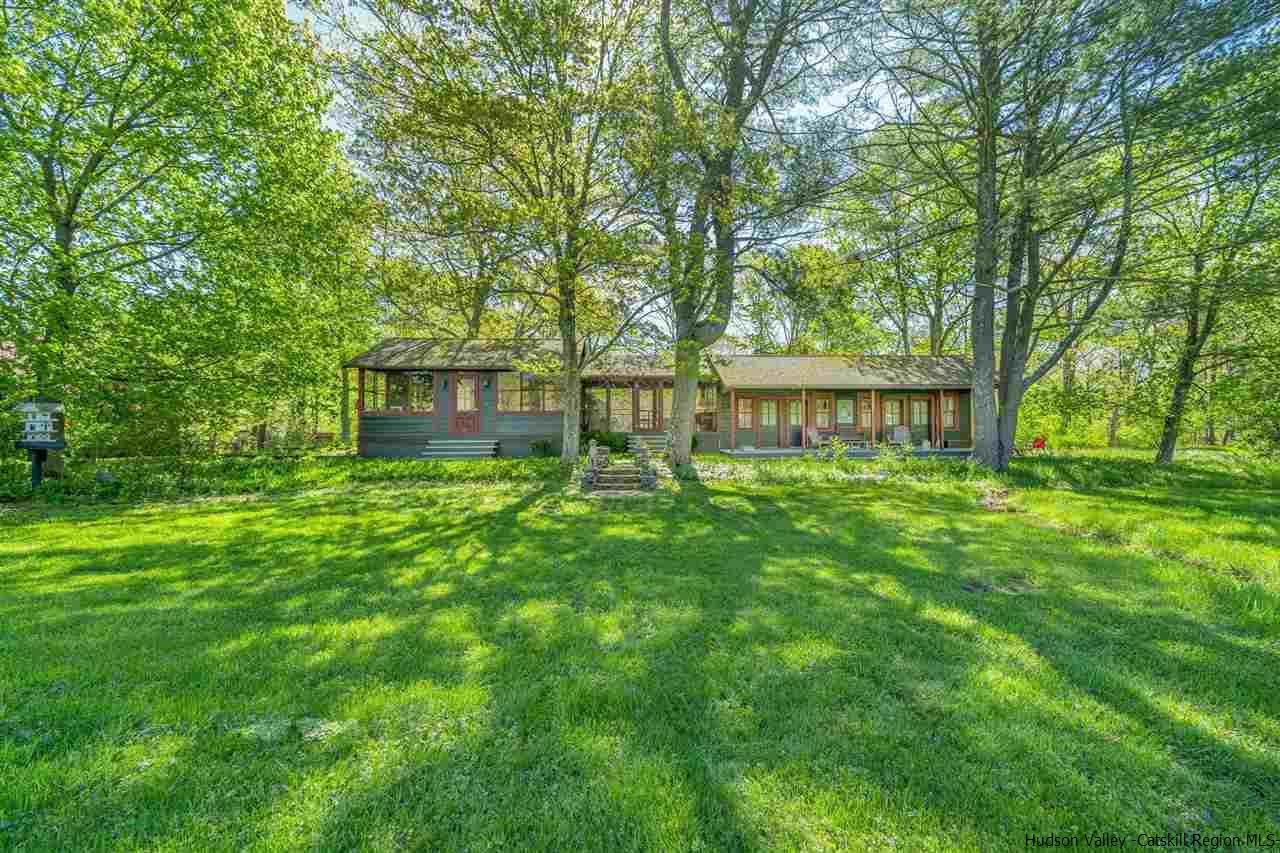 1245 High Falls Road Catskill, NY 12414 - Photo 8 of 34 a view of a house with a yard and a garden