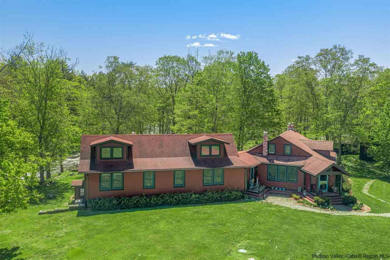 1245 High Falls Road Catskill, NY 12414 - Photo 9 of 34 a front view of a house with a yard and trees