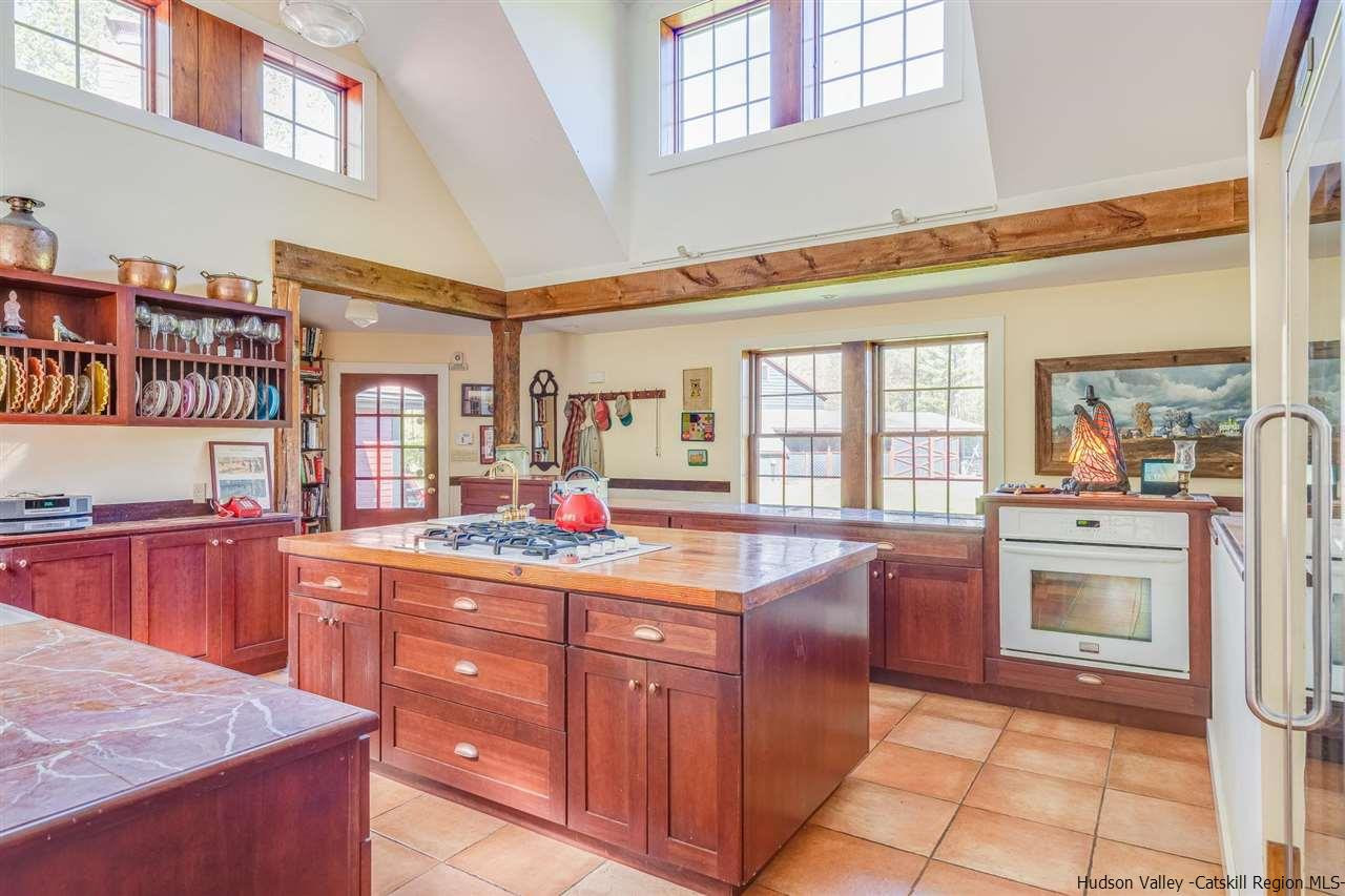 1245 High Falls Road Catskill, NY 12414 - Photo 10 of 34 a kitchen with stainless steel appliances granite countertop a sink and cabinets