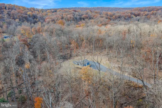 a aerial view of a house with a yard