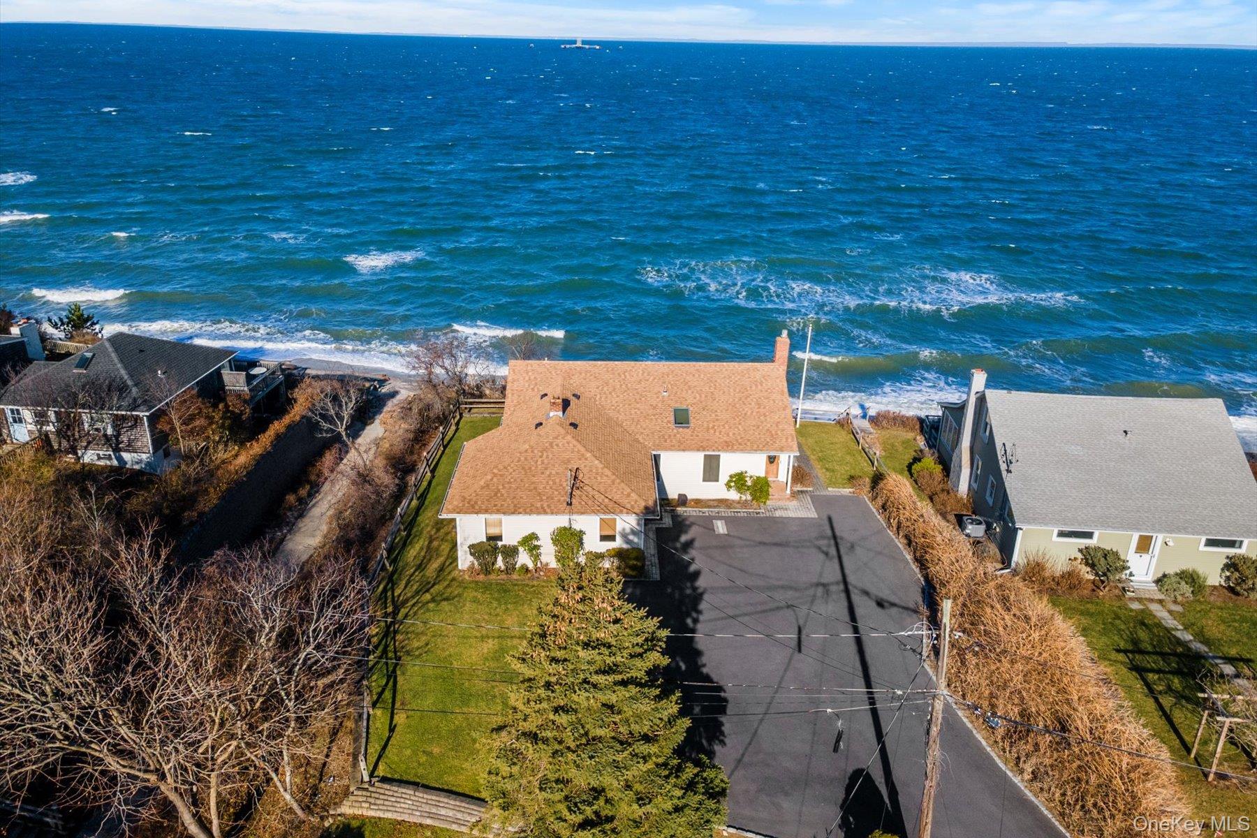 18 N Walk Riverhead, NY 11901 - Photo 1 of 1 an aerial view of a house with a yard