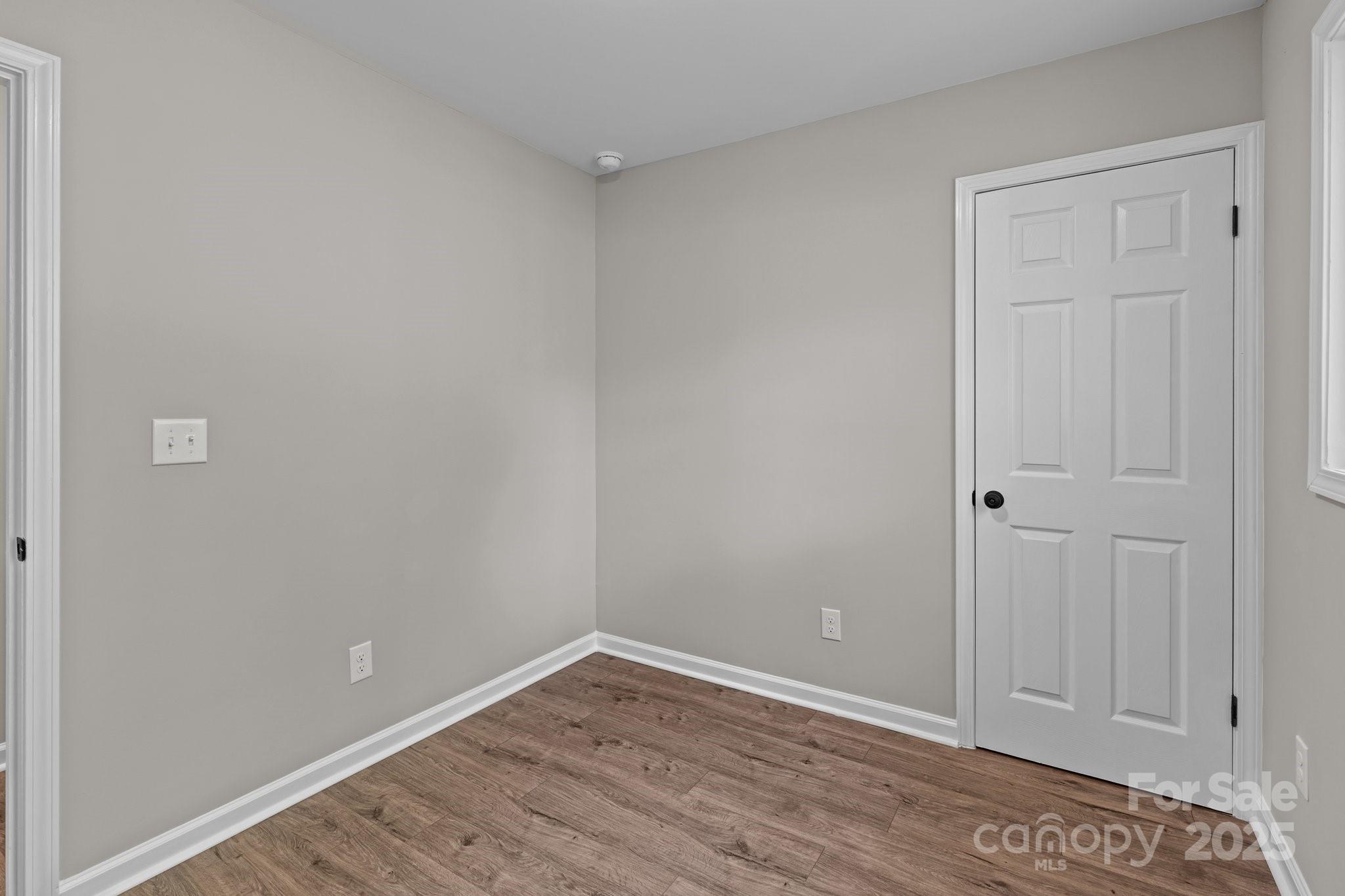 880 Legion Club Road Salisbury, NC 28146 - Photo 14 of 35 a view of an empty room with wooden floor
