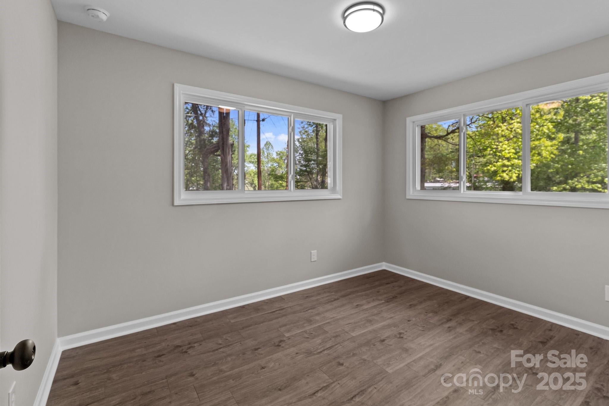 880 Legion Club Road Salisbury, NC 28146 - Photo 20 of 35 a view of a big room with wooden floor and windows