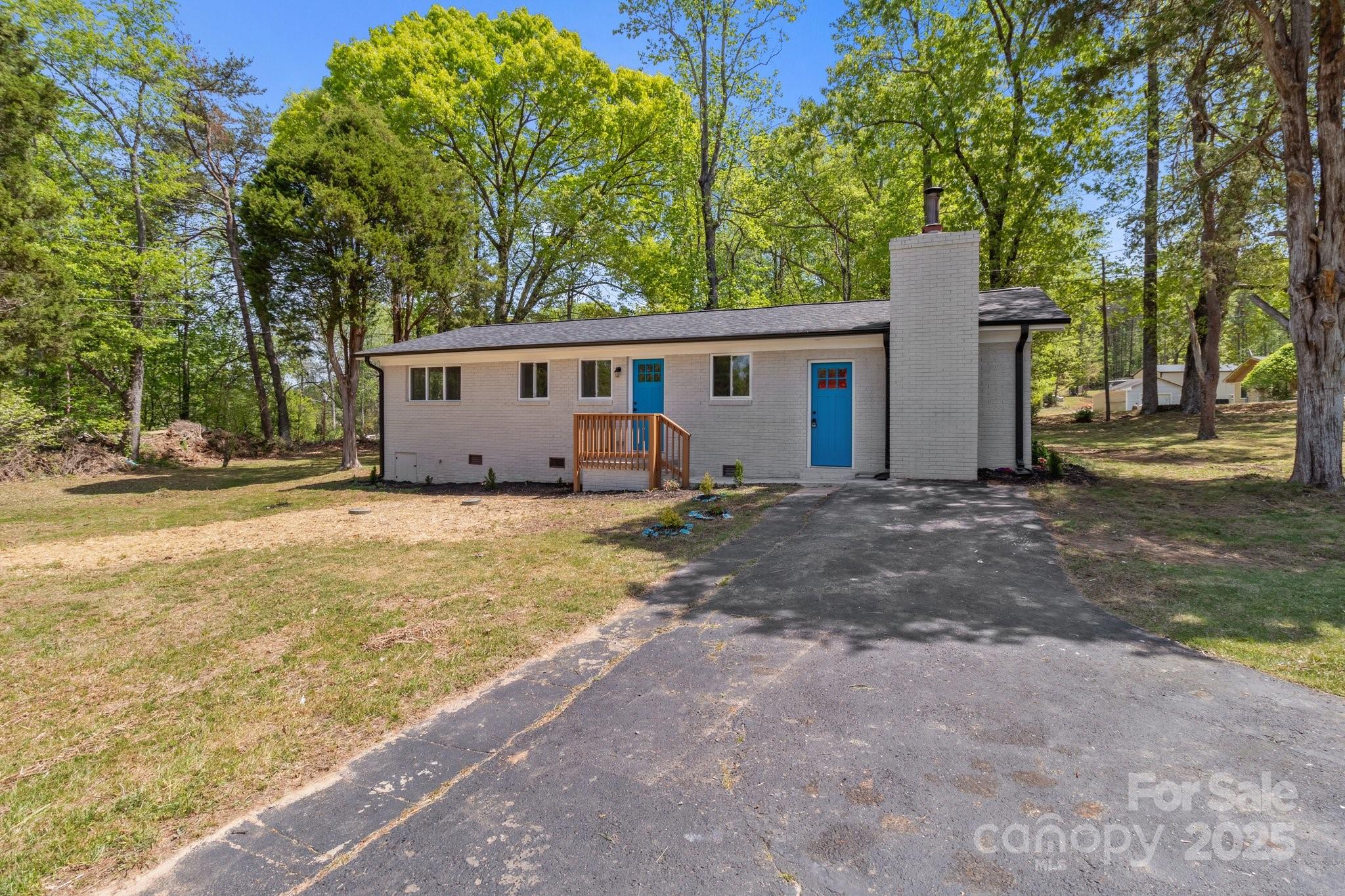 880 Legion Club Road Salisbury, NC 28146 - Photo 2 of 35 a view of a house with backyard and trees