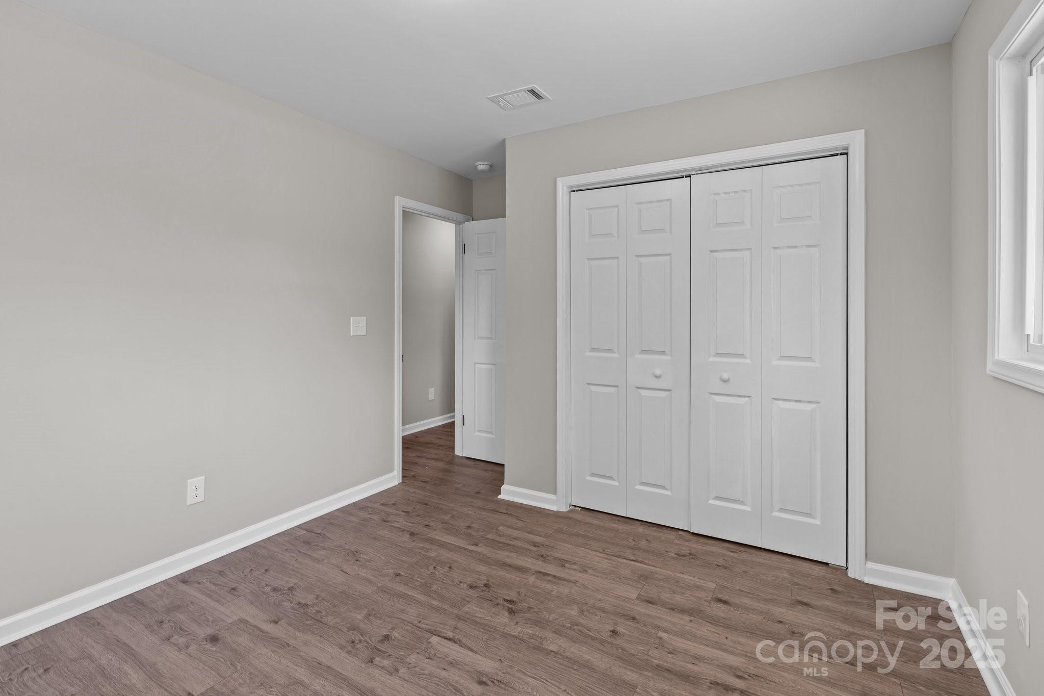880 Legion Club Road Salisbury, NC 28146 - Photo 21 of 35 a view of an empty room with wooden floor