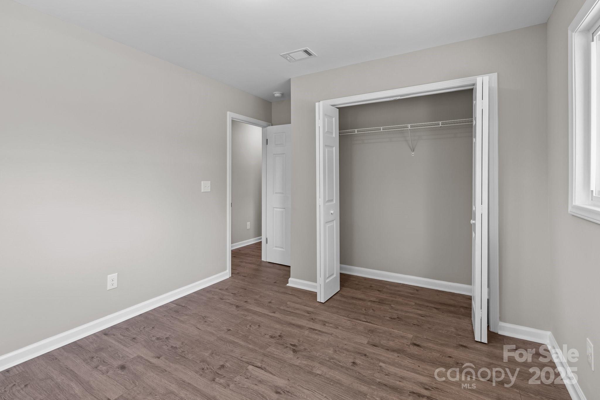 880 Legion Club Road Salisbury, NC 28146 - Photo 22 of 35 a view of an empty room with wooden floor