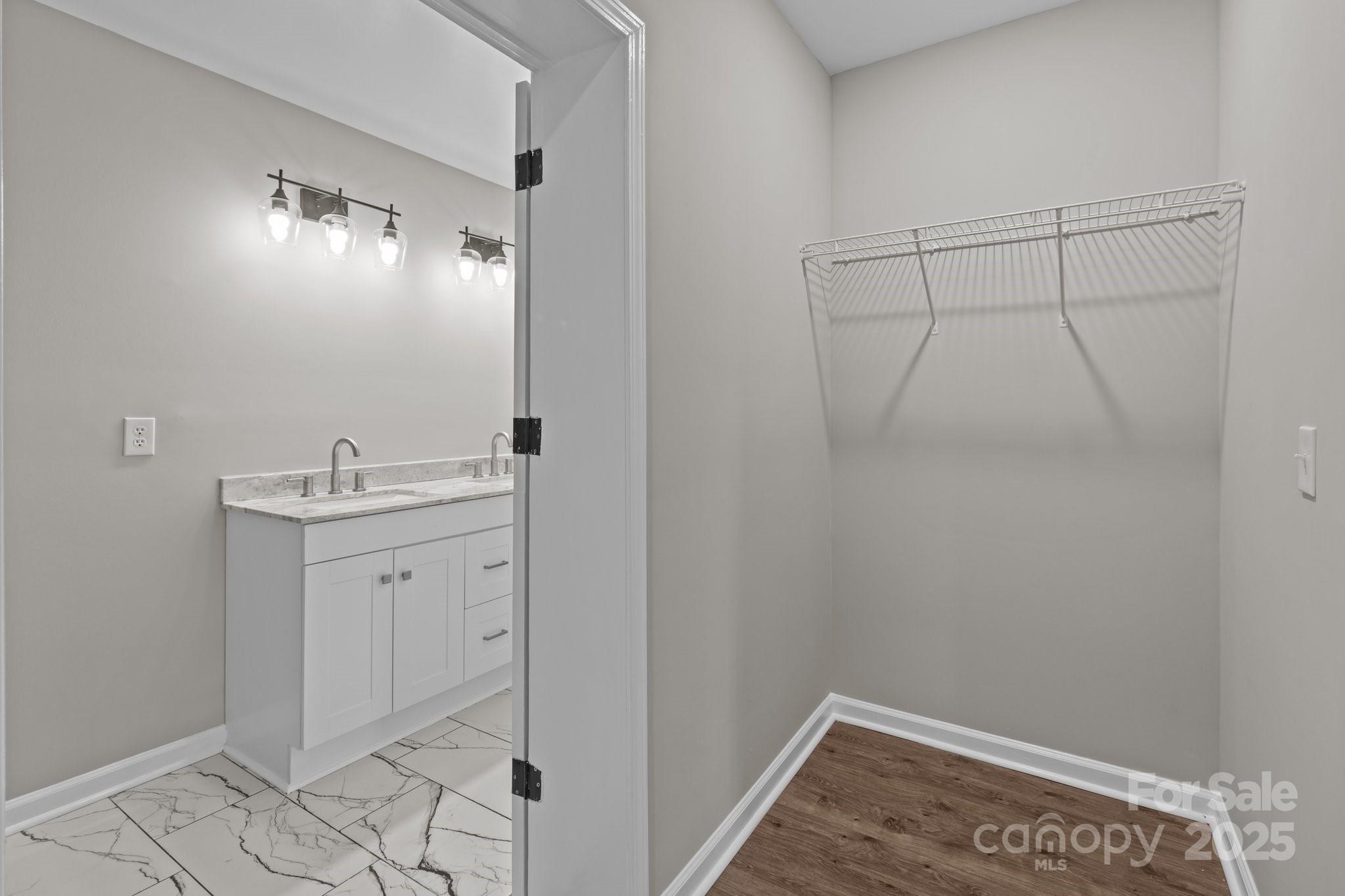 880 Legion Club Road Salisbury, NC 28146 - Photo 28 of 35 a bathroom with a sink and mirror
