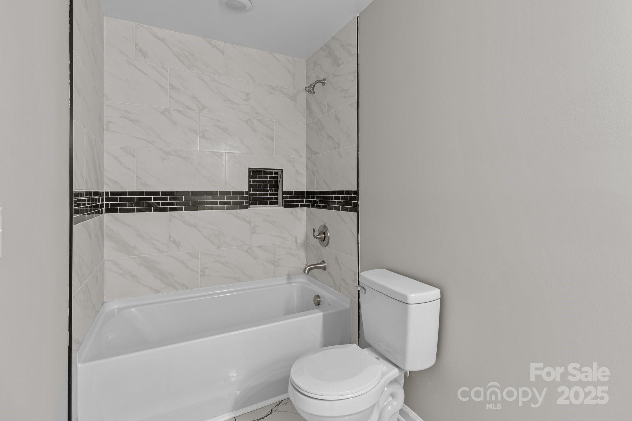 880 Legion Club Road Salisbury, NC 28146 - Photo 31 of 35 a bathroom with a toilet and a shower