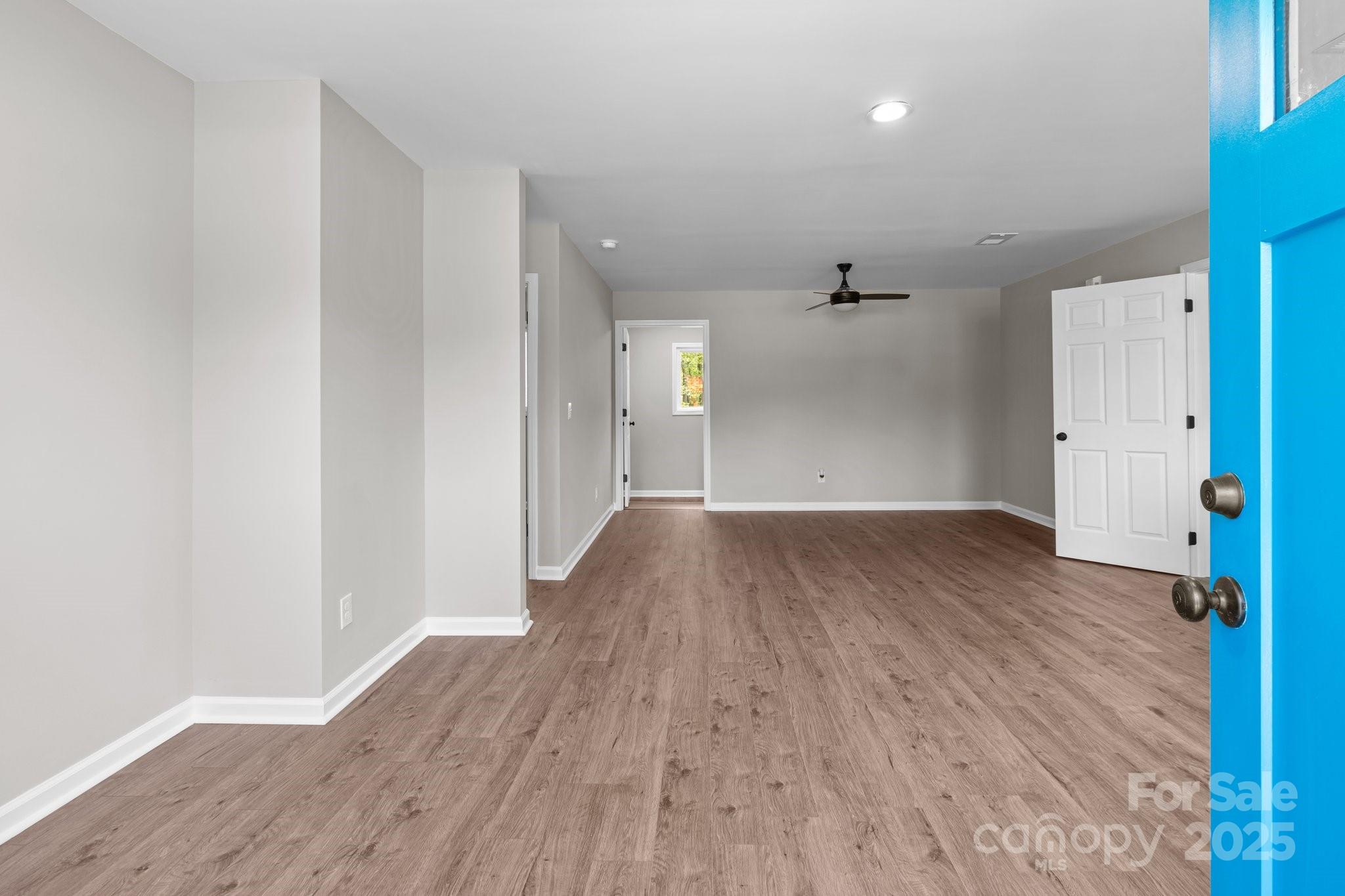 880 Legion Club Road Salisbury, NC 28146 - Photo 5 of 35 a view of a room with wooden floor and a hallway