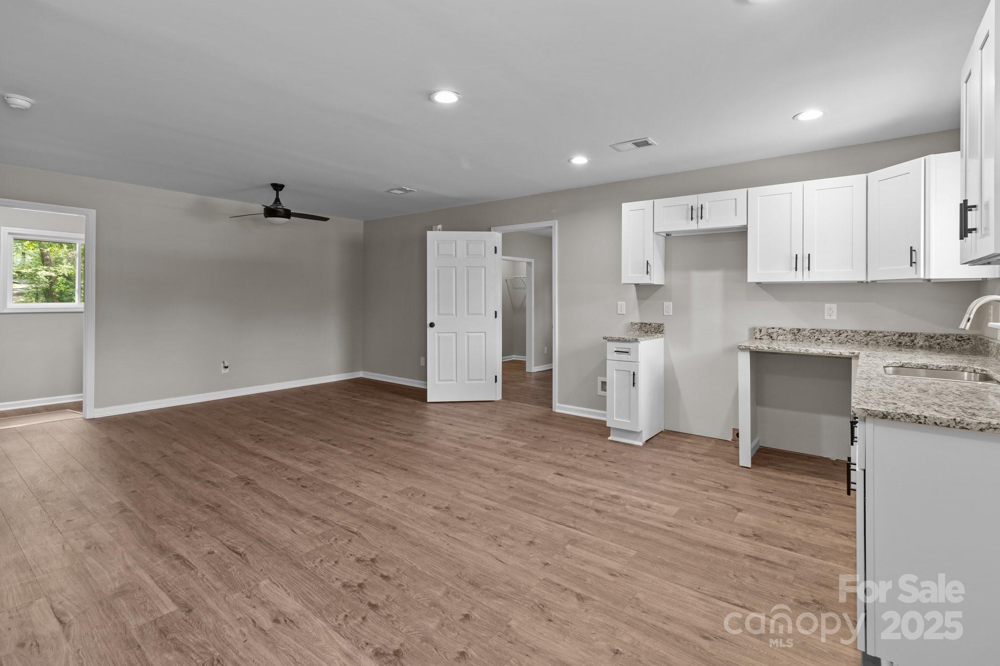880 Legion Club Road Salisbury, NC 28146 - Photo 6 of 35 a view of a kitchen with a sink and cabinets