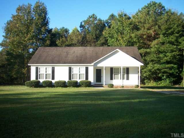 1439 Lee Road Clayton, NC 27520 - Photo 2 of 10 a front view of a house with a yard table and chairs