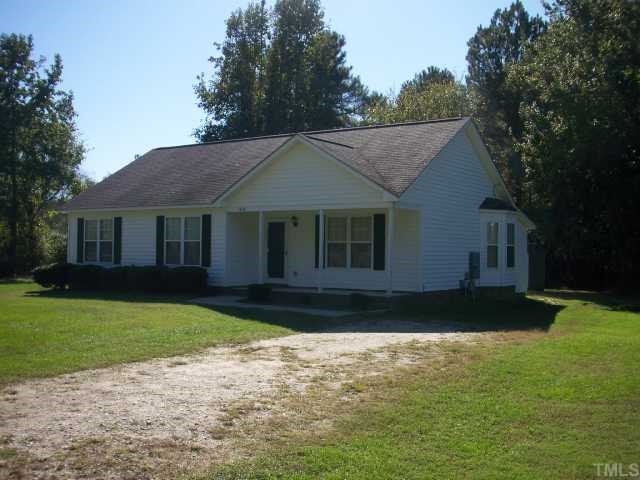 1439 Lee Road Clayton, NC 27520 - Photo 8 of 10 a front view of a house with a garden