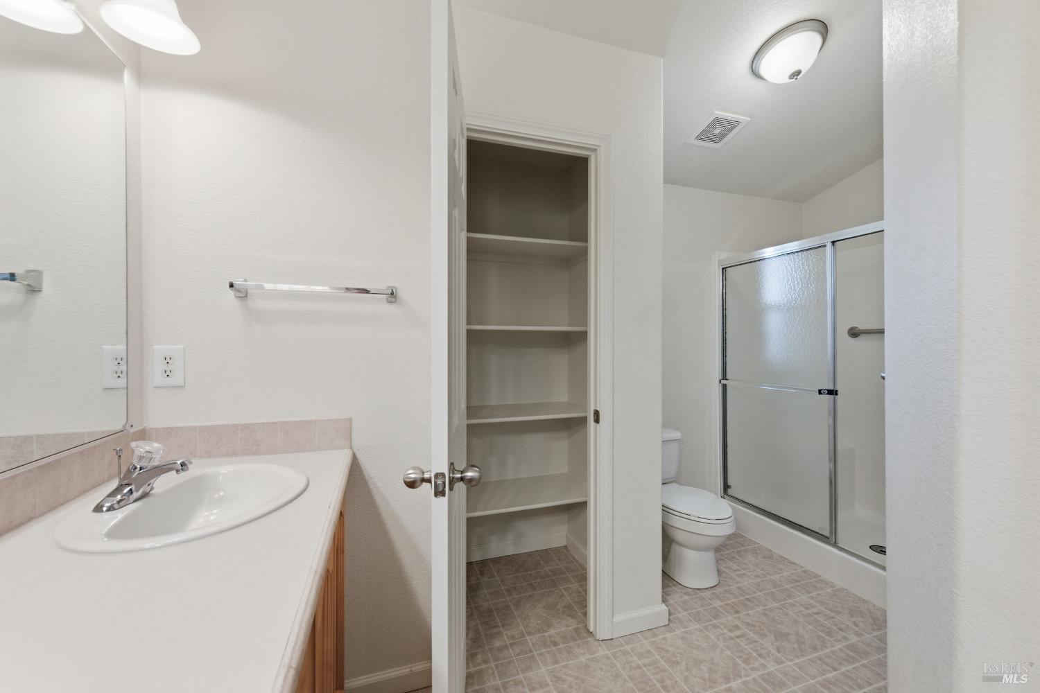 2412 Foothill Boulevard, Unit 15 Calistoga, CA 94515 - Photo 13 of 16 a bathroom with a sink and a mirror