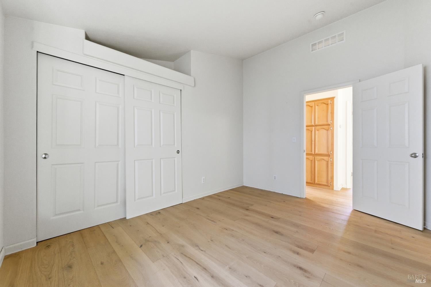 2412 Foothill Boulevard, Unit 15 Calistoga, CA 94515 - Photo 14 of 16 a view of empty room with wooden floor and fan