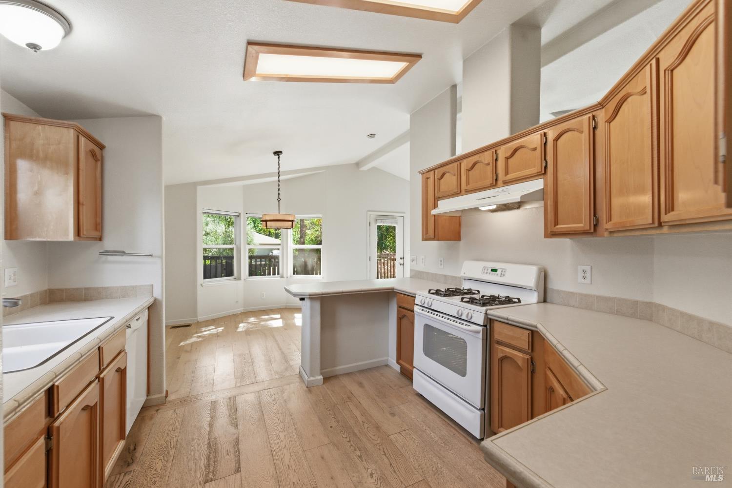 2412 Foothill Boulevard, Unit 15 Calistoga, CA 94515 - Photo 8 of 16 a kitchen with stainless steel appliances granite countertop a stove and a sink