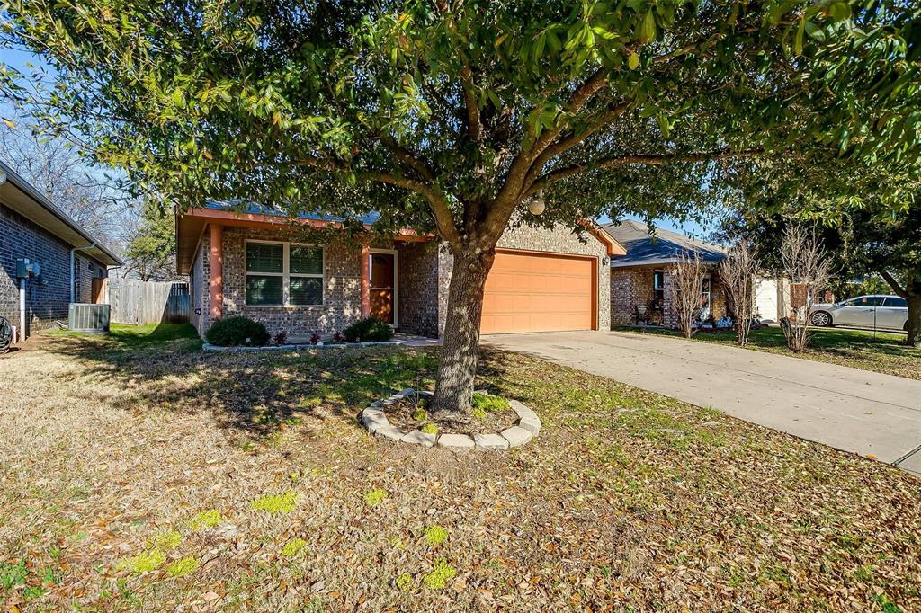 414 Tinker Trail Burleson, TX 76028 - Photo 1 of 38 View of front facade with a garage, central AC unit, and a front yard