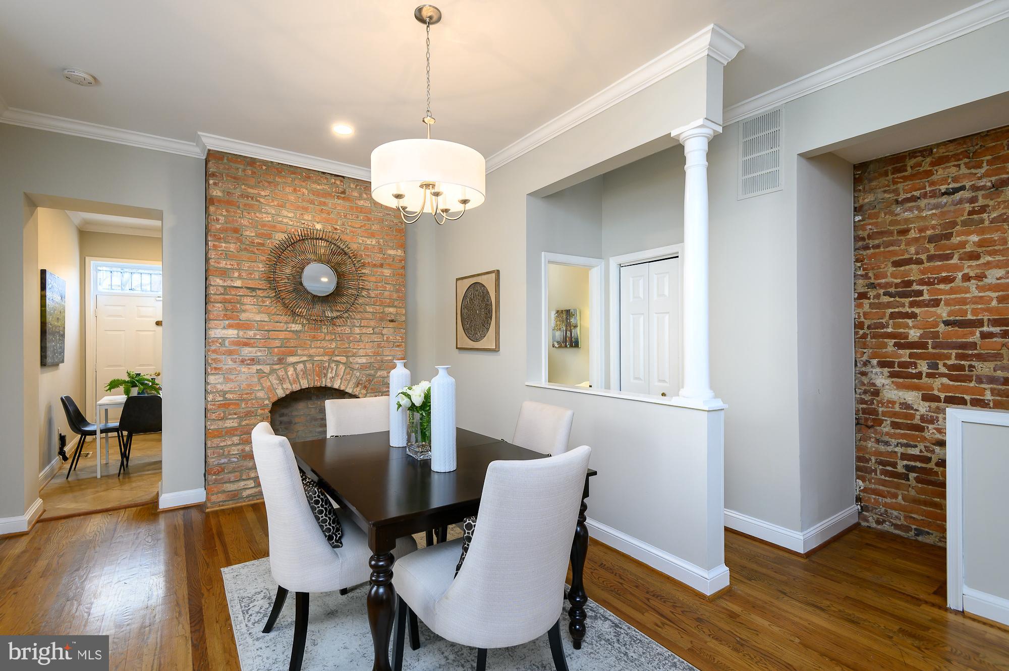 1413 F Street Northeast Washington, DC 20002 - Photo 9 of 44 Dining area w/ exposed brick decorative fireplace