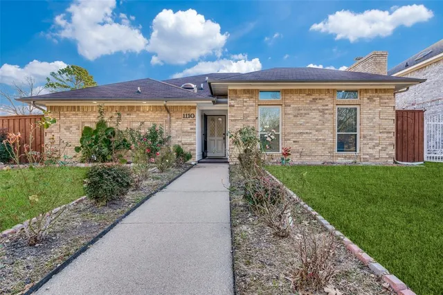 a view of a house with a garden
