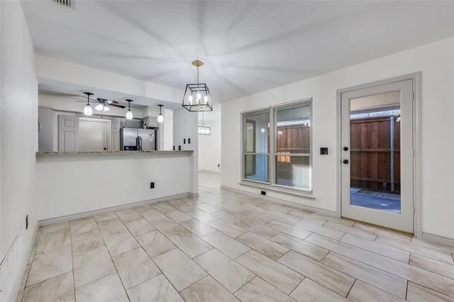 a view of a kitchen with a sink and cabinets