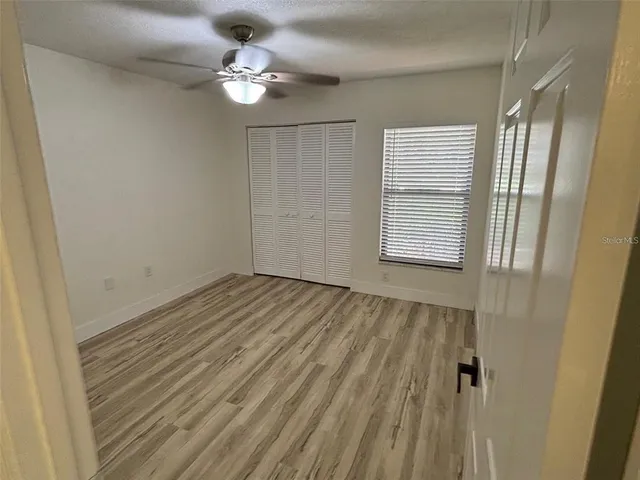 a view of an empty room with a window