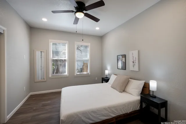 a bedroom with a large bed and a window