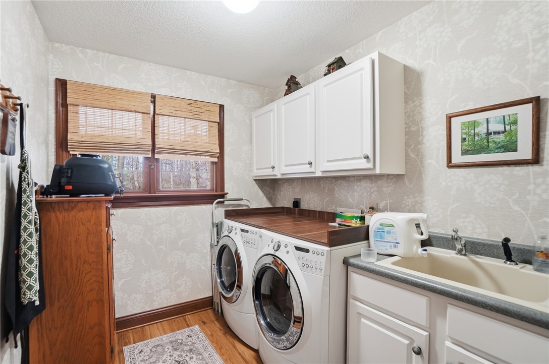 5300 Brookshire Lane Springfield, OH 45502 - Photo 41 of 56 Functional laundry room offers convenience with practical appliances and ample storage.