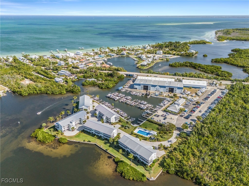 16641 Stringfellow Road, Unit 506 Bokeelia, FL 33922 - Photo 32 of 43 a view of an ocean with a nearby beach